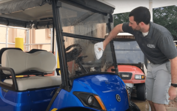 Man Cleaning Golf Cart